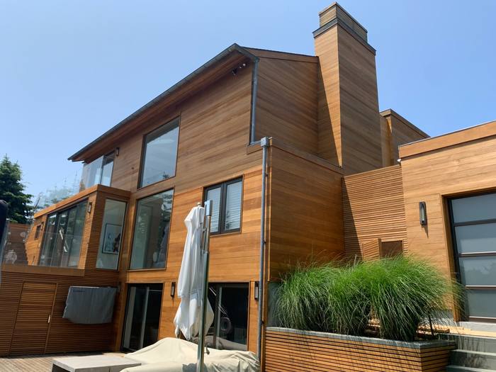Exterior painting of a shingle-style Hamptons home