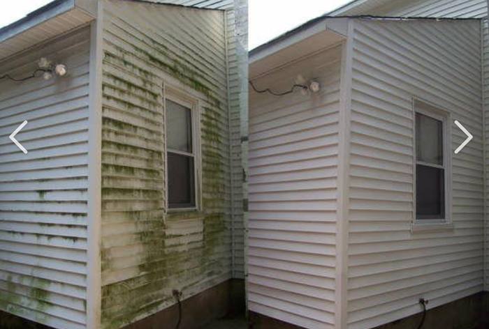 Power washing the siding of a home in the Hamptons