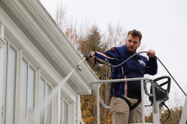Power washing a home exterior in Westhampton NY