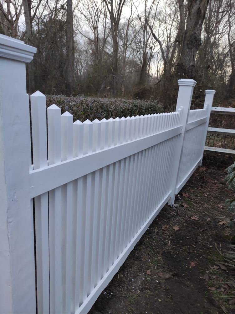 Newly painted picket fence with square posts in the Hamptons
