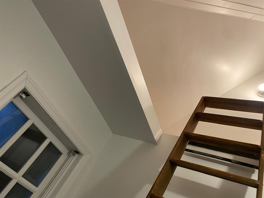 Smooth finished walls and ceiling in a pool house after repair