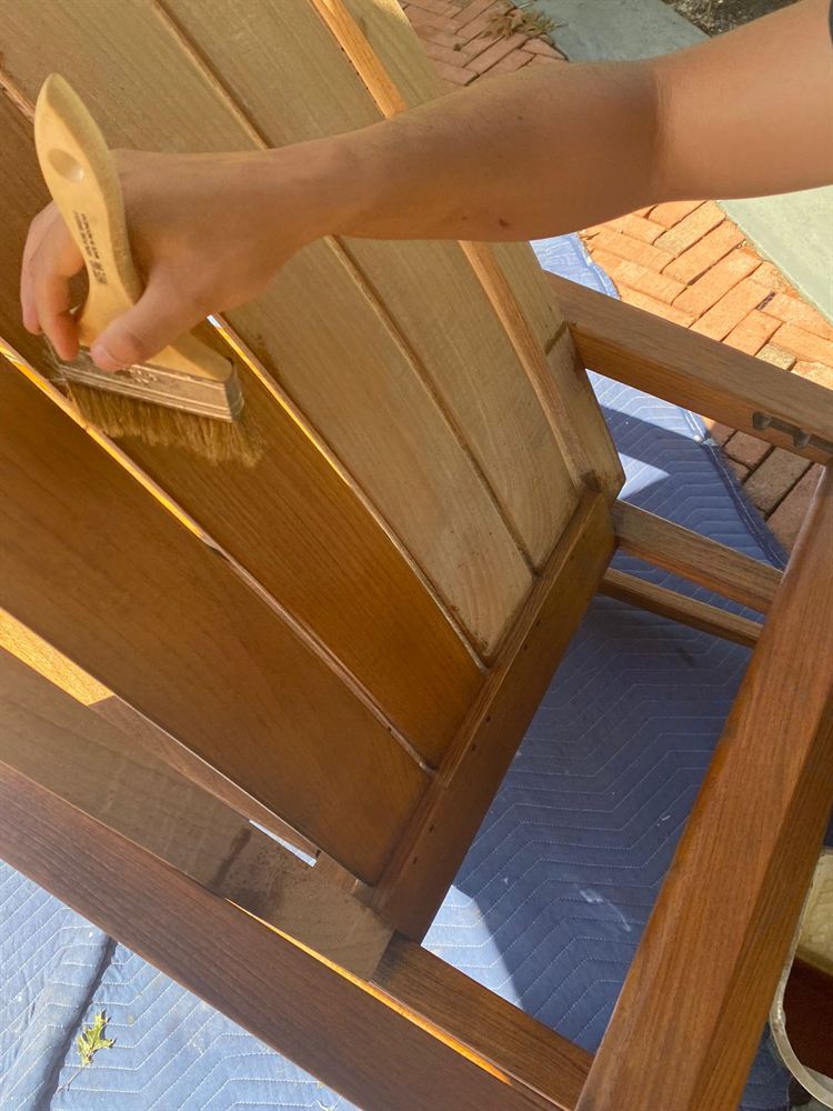 Teak armchair hand-oiled back to a warm natural color during restoration